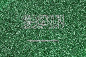 Saudi Arabia flag depicted on many small shiny sequins. Colorful festival background for party photo
