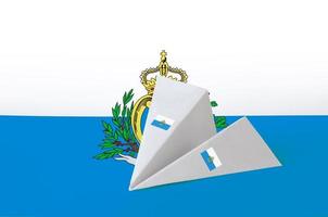 San Marino flag depicted on paper origami airplane. Handmade arts concept photo