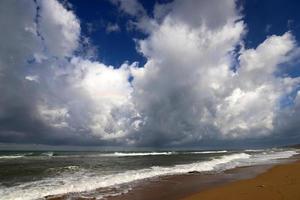 Rain clouds in the sky over the Mediterranean Sea in northern Israel. photo