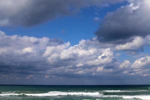 Rain clouds in the sky over the Mediterranean Sea in northern Israel. photo