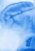 Watercolor liquid blue and white background texture. Hand painted watercolour backdrop. Stains on paper. photo