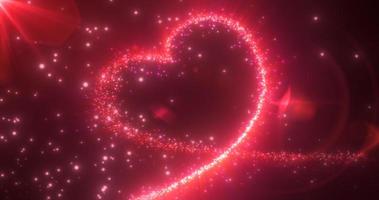 Abstract glowing festive heart love red from the lines of magical energy from particles on a dark background for Valentine's Day. Abstract background photo