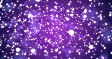 Abstract bright glowing festive purple circles with blur effect and energy magical bokeh on purple background. Abstract background photo