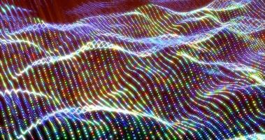 Abstract bright glowing multicolored rainbow waves and lines from particles and dots in the form of a field with a blur effect. Abstract background photo