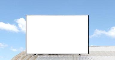 Outdoor billboard on roof and blue sky background with white background mock up. clipping path photo