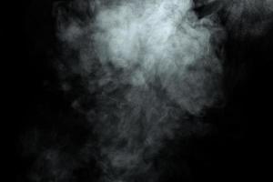 Abstract  powder or smoke isolated on black background photo