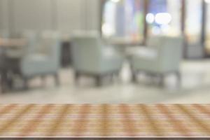 Top desk with blur restaurant background,wooden table photo