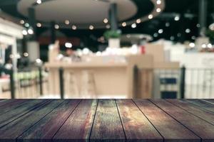 Top desk with blur restaurant background,wooden table photo