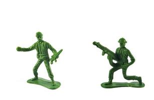 Group of Miniature hold gun toy soldier isolated on white background photo