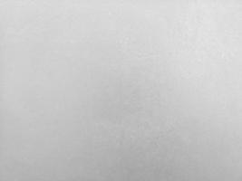 grieta de pintura descolorida en la pared de cemento color gris pulido desnudo y textura de superficie lisa material de hormigón detalle de fondo vintage arquitecto construcción paredes de ladrillo enlucidas y pintadas foto