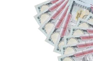 1000 Nepalese rupees bills lies isolated on white background with copy space. Rich life conceptual background photo