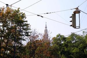 Travel to Vienna, Austria. The view on the park with the telephone wires on the foreground in the sunny day. photo