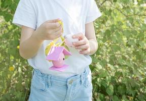 Cute little child wearing bunny ears on Easter day photo