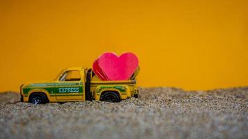 Minahasa, Indonesia  December 2022, the toy cars transporting hearts photo