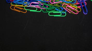 Paper clip isolated on a black background photo