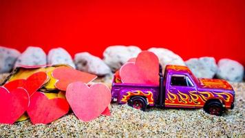 Minahasa, Indonesia  December 2022, the toy cars transporting hearts photo