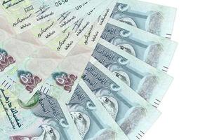 500 UAE dirhams bills lies isolated on white background with copy space stacked in fan shape close up photo