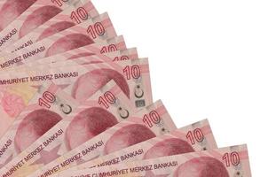 10 billetes de liras turcas se encuentran aislados en fondo blanco con espacio de copia apilado en el ventilador de cerca foto