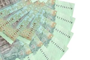 20 Ukrainian hryvnias bills lies isolated on white background with copy space stacked in fan shape close up photo