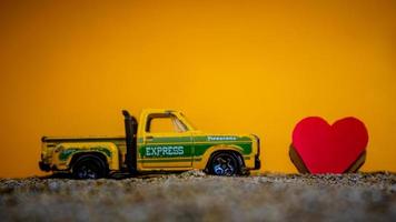 Minahasa, Indonesia  December 2022, the toy car with a heart in front of it photo