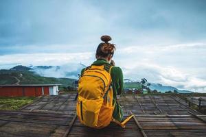 women asians travel relax in the holiday. Photograph landscape on the Moutain.Thailand photo