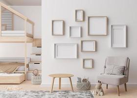 Various empty picture frames on white wall in modern child's room. Mock up interior in contemporary, scandinavian style. Free, copy space for picture. Group of frames. Cozy room for kids. 3D render. photo