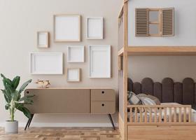 Various empty picture frames on beige wall in modern child's room. Mock up interior in contemporary, scandinavian style. Free, copy space for picture. Group of frames. Cozy room for kids. 3D render. photo