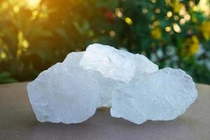 Crystal clear alum stones or Potassium alum on nature background.  Useful for beauty and spa treatment. Use to treat body odor under the armpits as deodorant and make water clear. photo