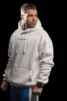 Portrait of a young man wearing a white hoodie photo