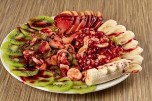 A plate of decorated mixed fruits