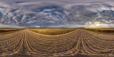 full seamless spherical 360 hdri panorama view among fields in autumn evening sunset with awesome blue pink red fluffy clouds in equirectangular projection, ready for VR AR virtual reality photo