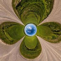 Blue little planet ball. Inversion of tiny planet transformation of spherical panorama 360 degrees. Spherical abstract aerial view. Curvature of space. photo