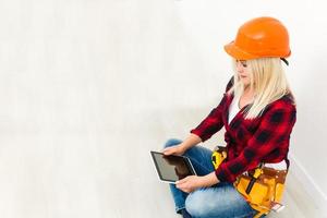 Woman architect with tablet isolated on white photo