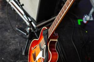 Guitar and other musical equipment on stage before concert photo