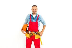 Young construction workers with hard hats on a white background photo