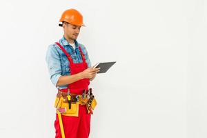 Construction Worker with a tablet. Planning Developer Concept photo