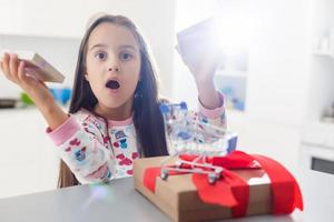 little girl thrilled with the gift she has received photo