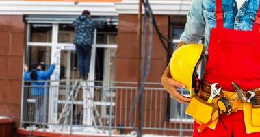 handyman with his helmet in warehouse photo