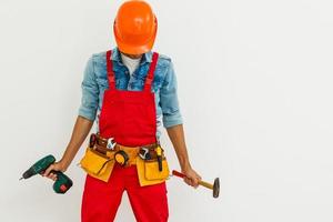 Portrait of cheerful young worker wearing hardhat over white background photo