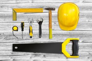 old tools on a wooden background photo