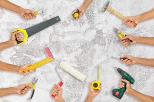 variety of tools for a constructions worker on the grunge white background photo