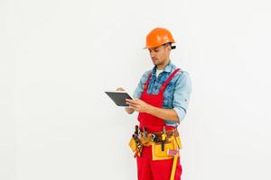 Construction Worker with a tablet. Planning Developer Concept photo