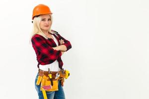 Sexy young woman construction worker photo