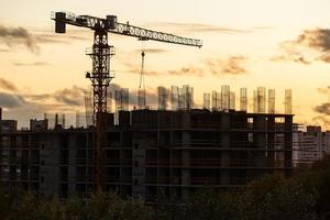 The construction crane on sunset photo