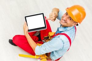 Construction worker holding digital tablet, repair, construction concept photo