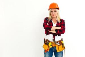 Sexy young woman construction worker photo