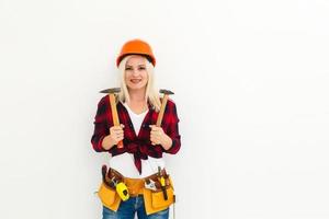 working woman in helmet with tools photo