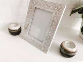 Two beautiful lanterns made of glass and decorated with metal wire. photo