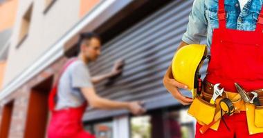 Worker with a tool belt photo