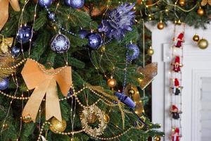 Beautiful Christmas tree with garlands, balls and toys photo